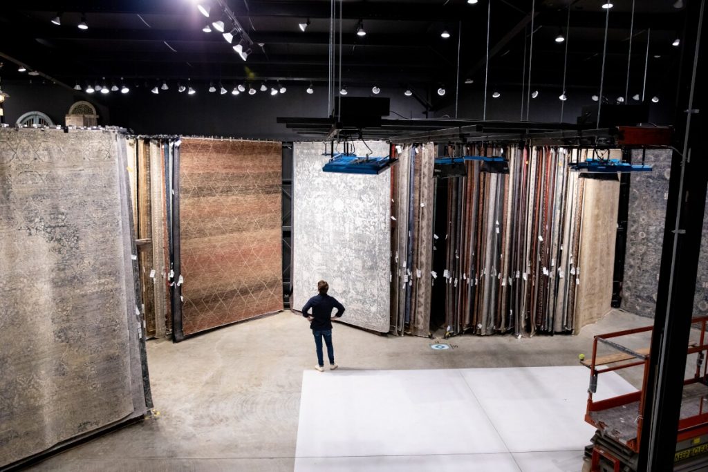 Green Front Furniture Den Cralle in farmville rug showroom with large area rug inventory in Virginia.