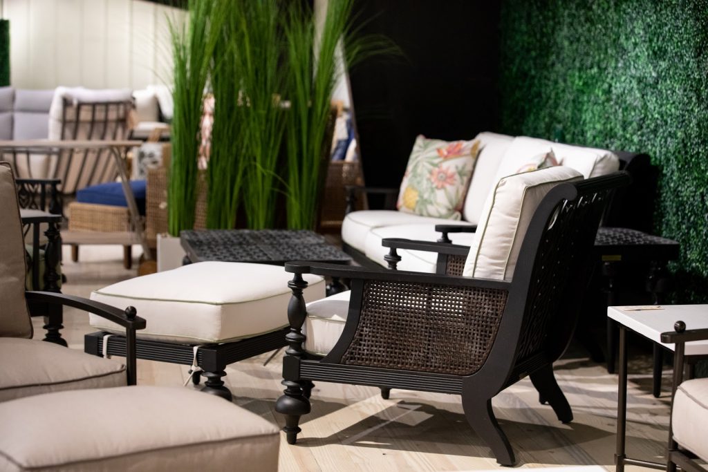Green Front Furniture Farmville outdoor patio seating showroom with woven chairs