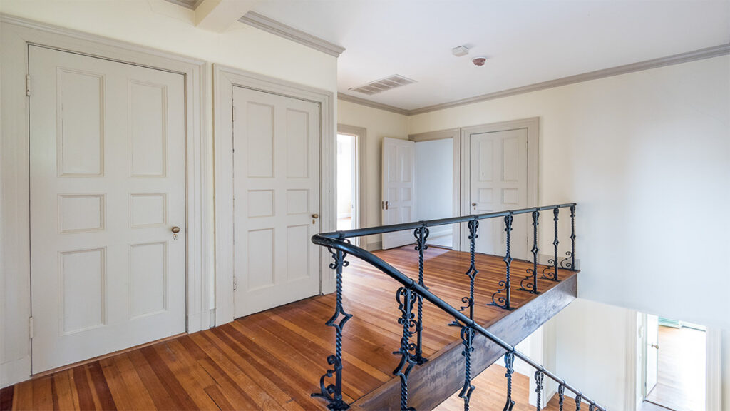 Green Front interiors project, iron railing on third floor