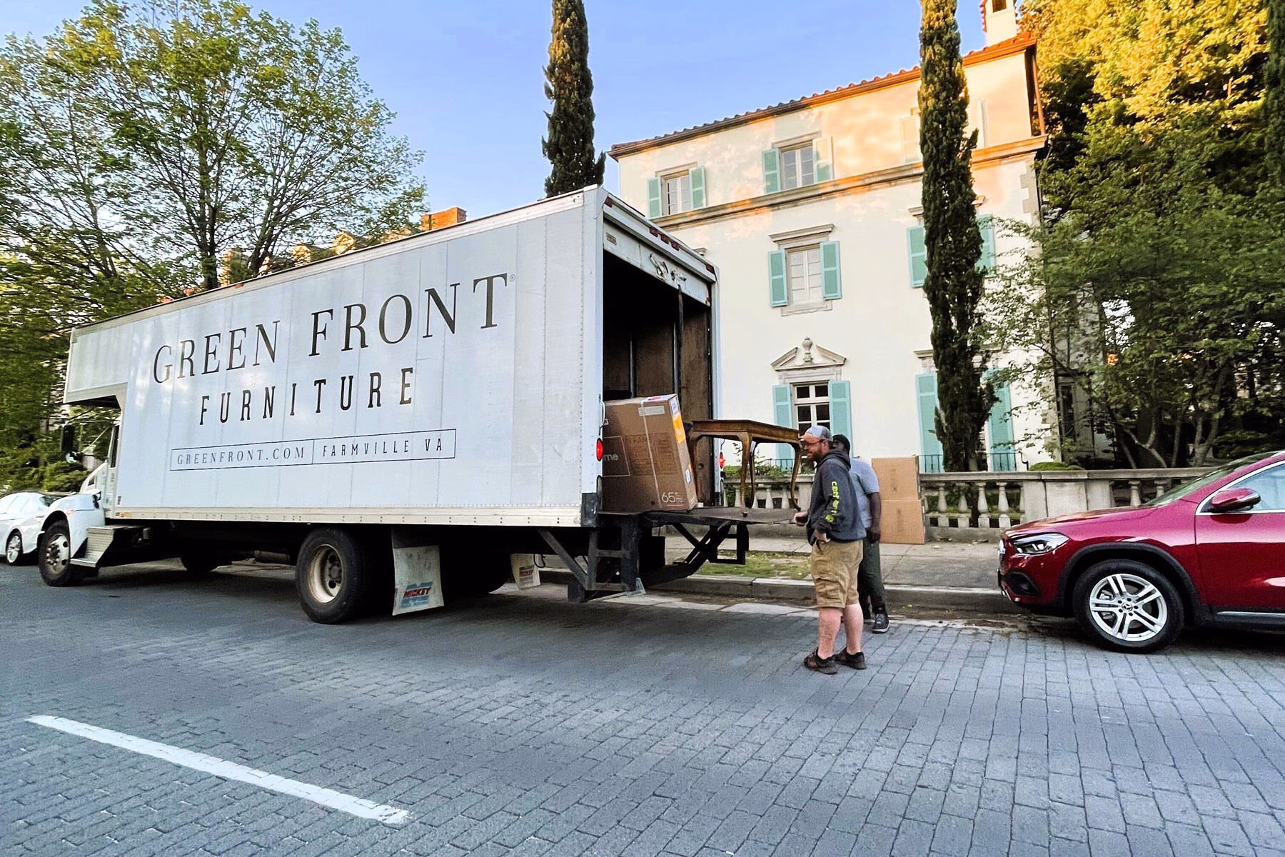 Craftsman furniture being unloaded from a Virginia furniture store with a curated furniture selection.