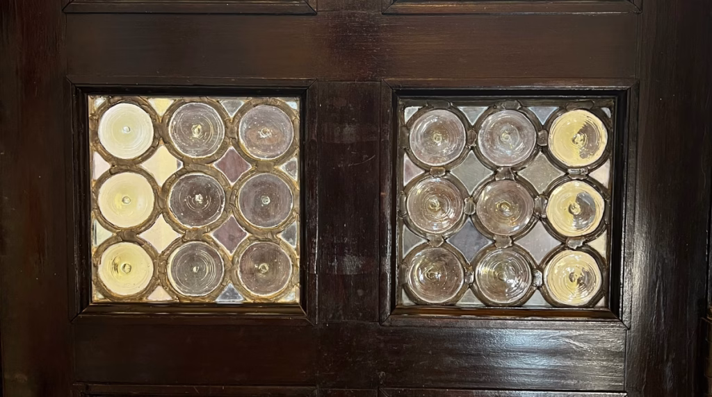 Preserving monument's historic glass rondel windows.